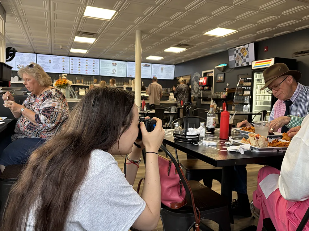 Adriana Bzovii taking photos